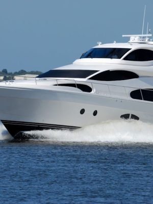 luxury-yacht-boat-speed-water-163236-163236 A modern luxury yacht cruising swiftly on a calm river under a clear blue sky.